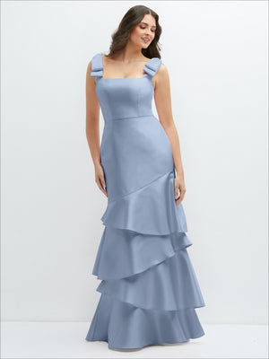 Bow-shoulder satin maxi dress in light blue with asymmetrical tiered ruffles at hem
