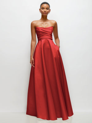 Red strapless draped satin maxi dress with full gathered skirt and waist bow detail