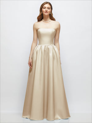 Champagne satin strapless drop-waist gown with full gathered skirt