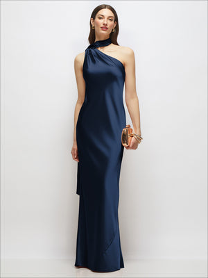 Draped one-shoulder satin maxi dress in midnight navy, sleeveless with bias sash detail