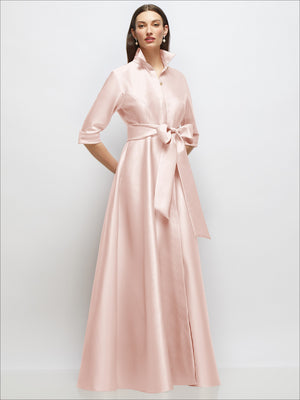 Blush satin shirt dress with 3/4 sleeves, bow sash at waist, jeweled button front