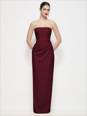 Burgundy strapless corset maxi dress with draped waist and column skirt