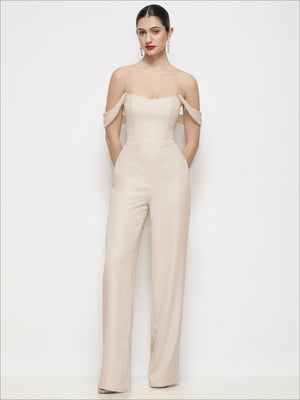 Light beige off-shoulder crepe wide-leg jumpsuit with fitted waist and long flared legs.