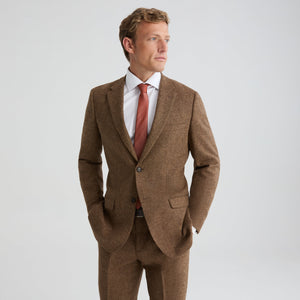 Brown tweed suit jacket with notch lapels, two-button front, flap pockets