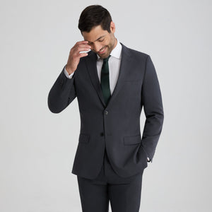 Men's charcoal gray suit jacket with notch lapels, center buttons, and two flap pockets