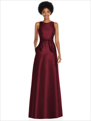 Jewel-neck V-back maxi dress in deep burgundy satin with waist bow and mini sash.