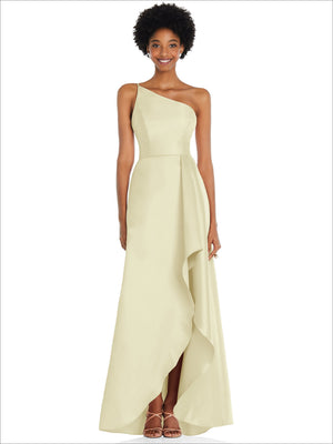One-shoulder satin gown in pale yellow with draped front and asymmetrical slit