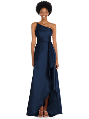 One-shoulder satin gown in deep navy with draped front slit and flowing skirt