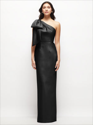 Black one-shoulder satin column maxi dress with oversized bow drape over one shoulder