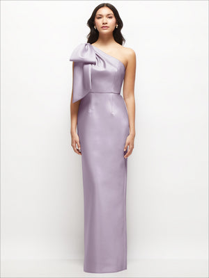 Lilac one-shoulder satin column maxi dress with oversized bow detail at the shoulder.