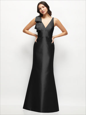 Black satin trumpet dress with deep V-back and one-shoulder bow detail