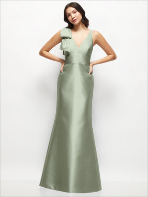 Sage green satin trumpet dress with one-shoulder cascading bow and fitted trumpet skirt