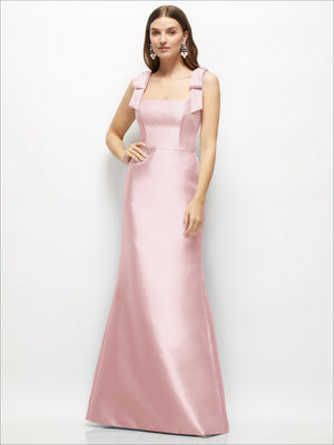 Satin fit-and-flare maxi dress in blush pink with shoulder bows, front view and fitted waist