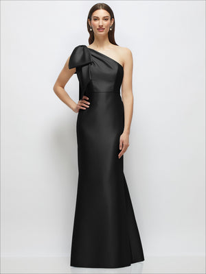 Black satin one-shoulder maxi dress with bow shoulder detail and trumpet skirt.