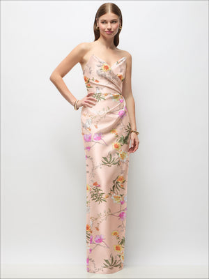 Blush satin maxi dress with multicolor floral print, strapless draped bodice, slit.