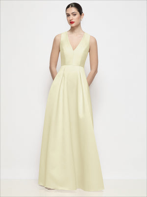 Pale yellow satin maxi dress with sleeveless V-neck and pleated skirt