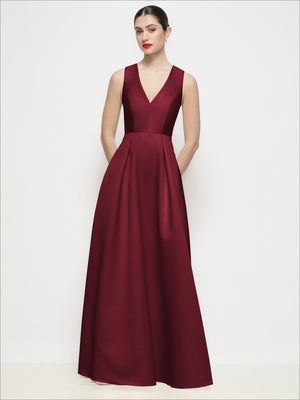 Burgundy satin V-neck sleeveless maxi dress with pleated skirt and fitted waist