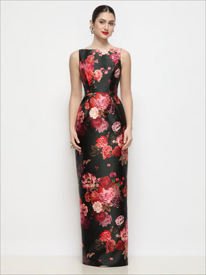 Black satin maxi dress with bateau neckline, fitted bodice, floral print pleated column skirt
