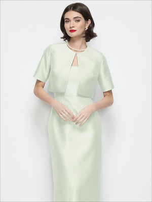 Cropped satin jacket with jewel neckline, short sleeves, front keyhole placket, pale sage green