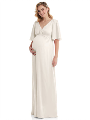 Ivory maternity maxi dress with empire waist, ruched bust, and flutter bell sleeves