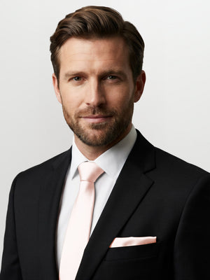 Classic yarn-dyed pocket square by After Six in pale pink on a suit breast pocket.